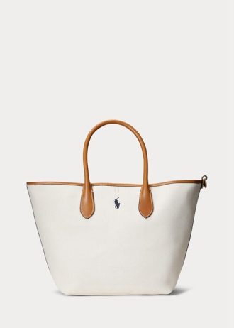 Bolsos tote medianos Bellport de lona reversible Ralph Lauren para mujer en color natural/azul marino