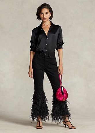 Vaqueros acampanados de tiro alto con ribete de plumas y cuentas de Ralph Lauren para mujer en color negro